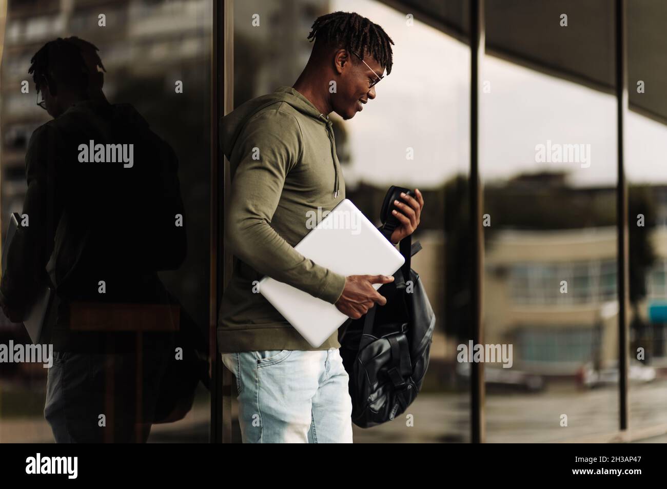 Happy smiling african american student, with backpack and laptop on ...