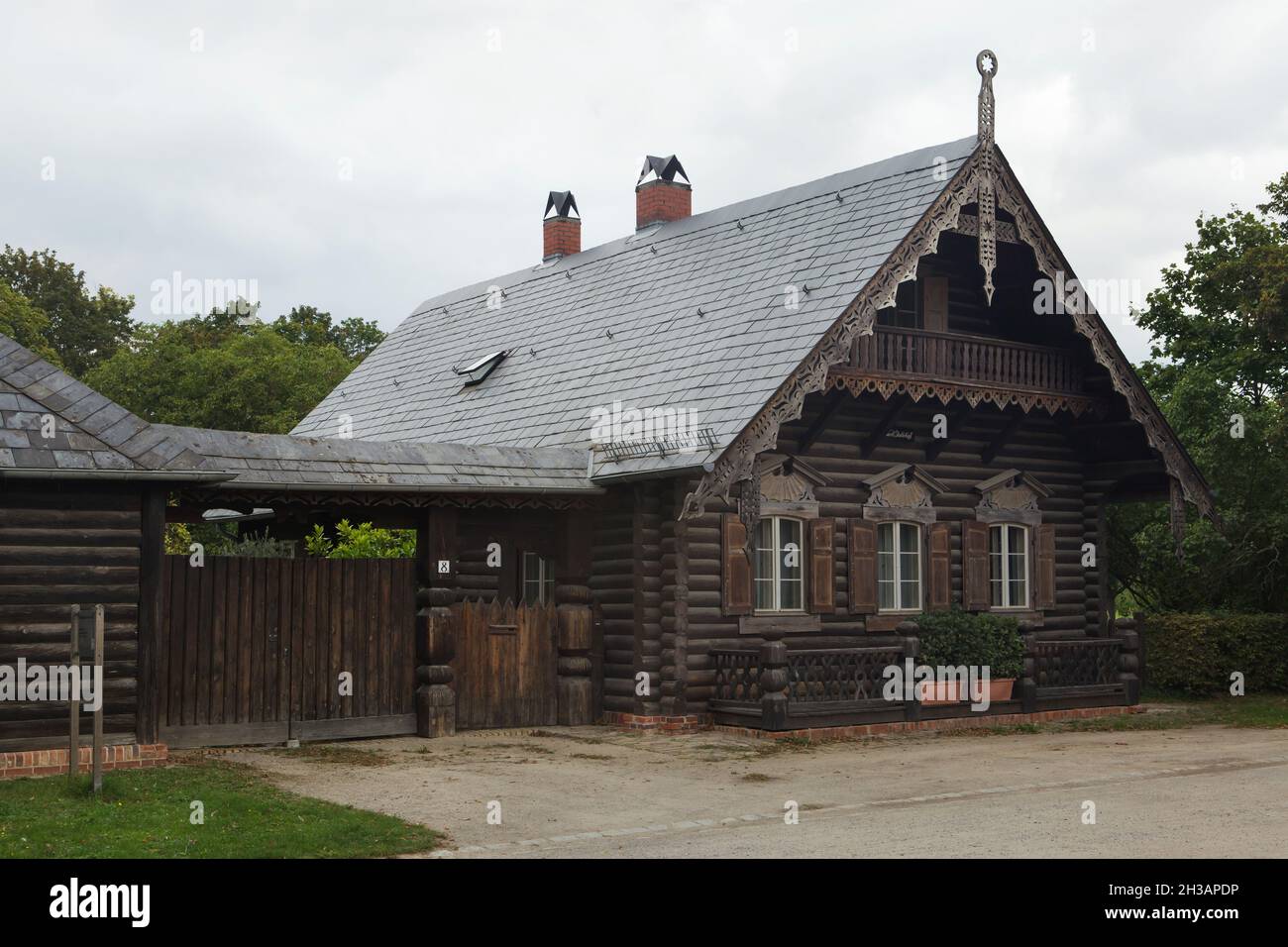 One of the traditional Russian wooden houses in the Russian Colony Alexandrowka (Russische Kolonie Alexandrowka) in Potsdam, Germany. Stock Photo