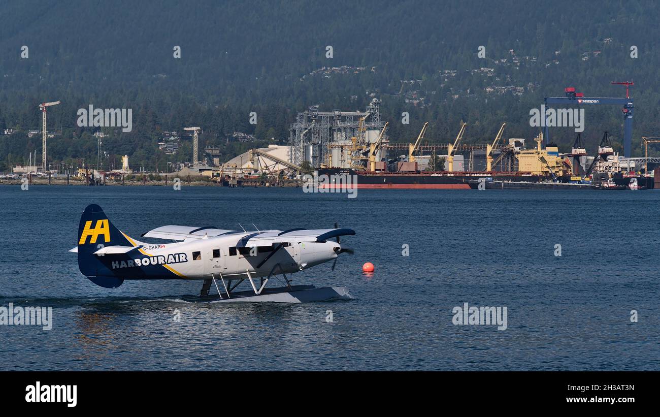 View of a de Havilland Canada DHC-3 Otter seaplane, operated by airline Harbour Air, taking off from Vancouver Harbour Flight Centre. Stock Photo