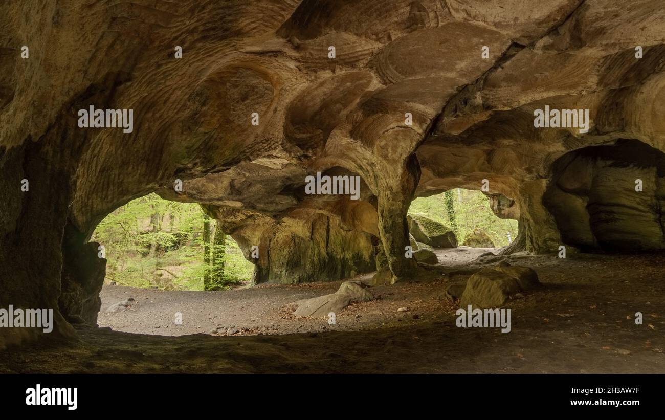 inside millstone cave Hohllay in the forest Mullerthal, Berdorf, Luxembourg Stock Photo