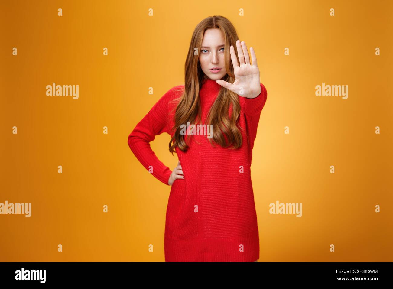 Confident sensual and attractive redhead female with self-assured gaze ...