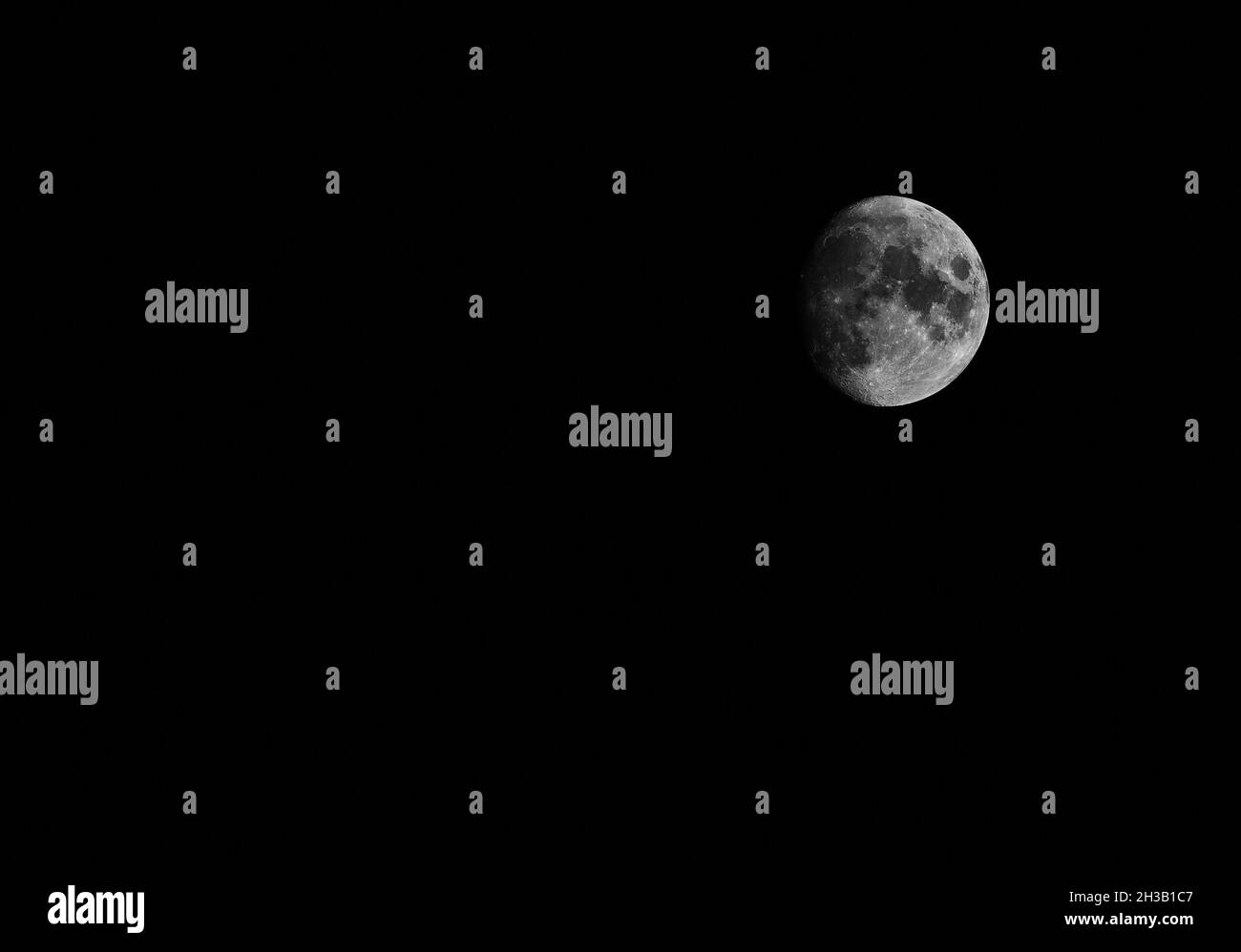 Waxing gibbous moon against a clear night sky in October Stock Photo