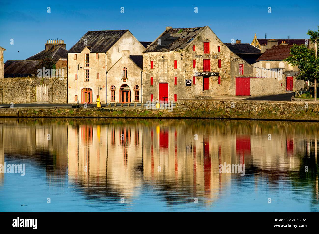 Old warehouses at Rathmelton on the river Lennon, County Donegal, Ireland Stock Photo