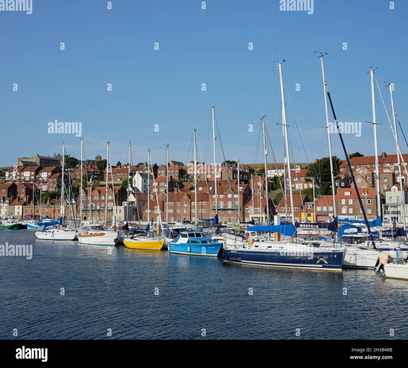 Yachts moored in the harbour marina of Whitby Yorkshire England UK ...