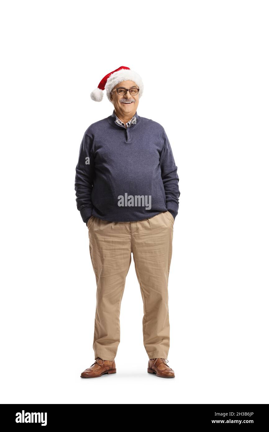 Full length portrati of a mature man wearing a christmas santa hat isolated on white background Stock Photo