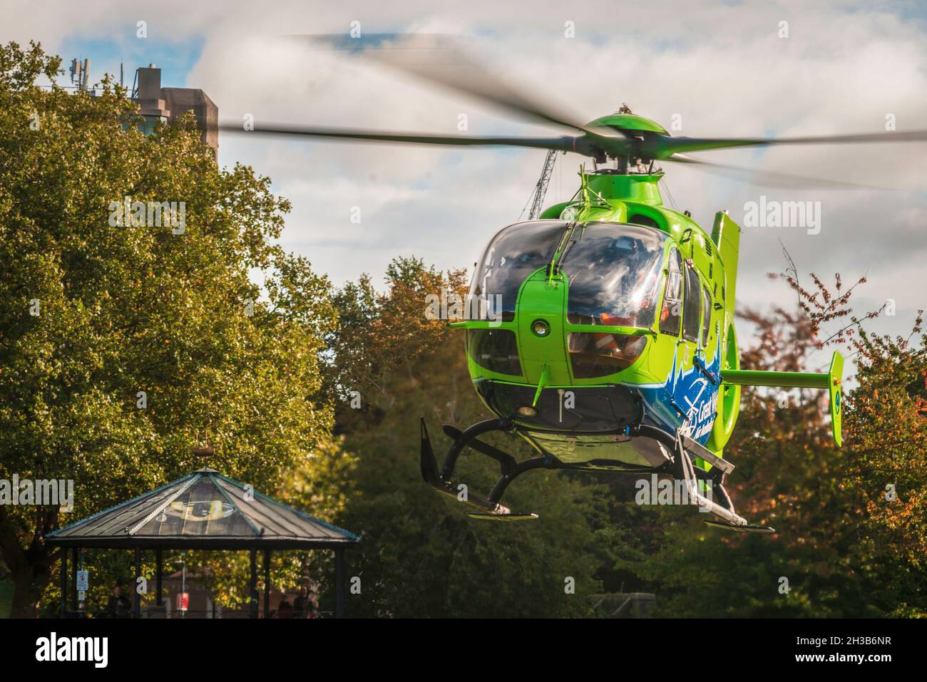 Great Western Air Ambulance Eurocopter EC135 taking off from Castle Park in Bristol, having just attended a medical emergency nearby. Stock Photo