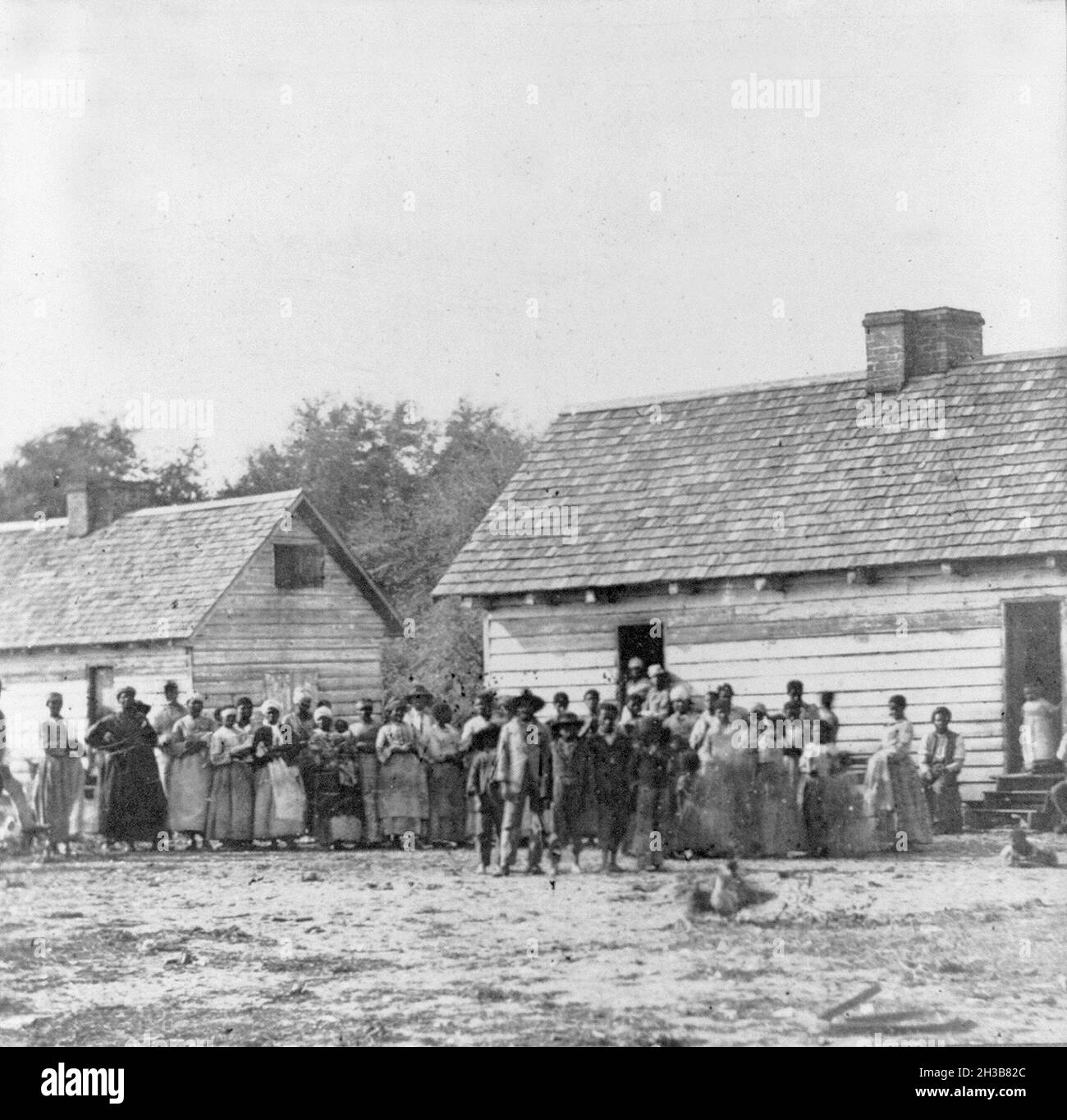 Vintage photograph circa 1862 during the confederacy era showing African American men women and children slaves on a southern plantation Stock Photo