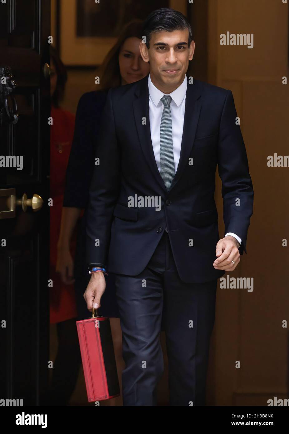 London, UK. 27th Oct, 2021. Chancellor of the Exchequer Rishi Sunak displays the red budget briefcase to the waiting media in Downing Street ahead of the Autumn Budget. Credit: SOPA Images Limited/Alamy Live News Stock Photo