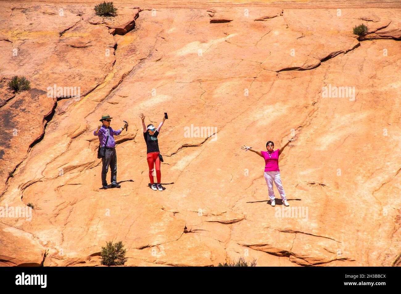 0f-24-2021 Zion Urah USA - People on a slope in Zion National Park in Utah USA taking advantage of the accostics to sing the religious song How Great Stock Photo