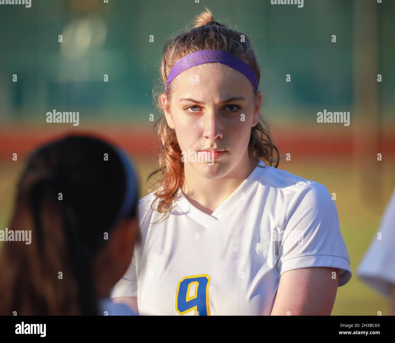 High school girl soccer player with serious game face expression Stock Photo