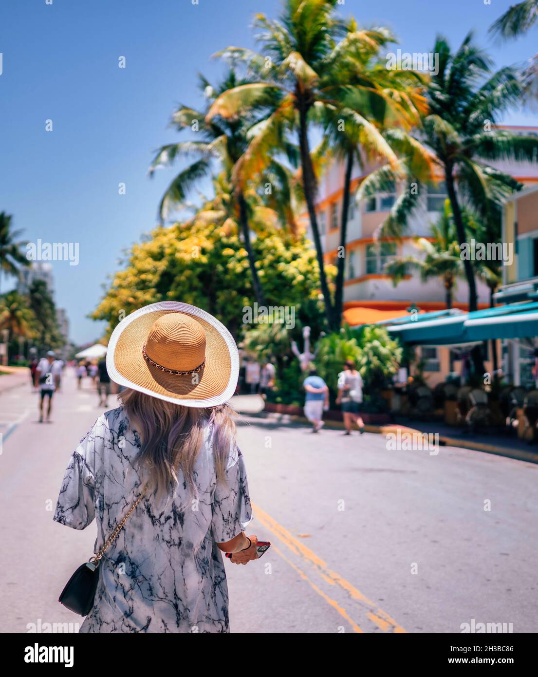 woman in a hat tropical vacation Miami Beach florida Stock Photo