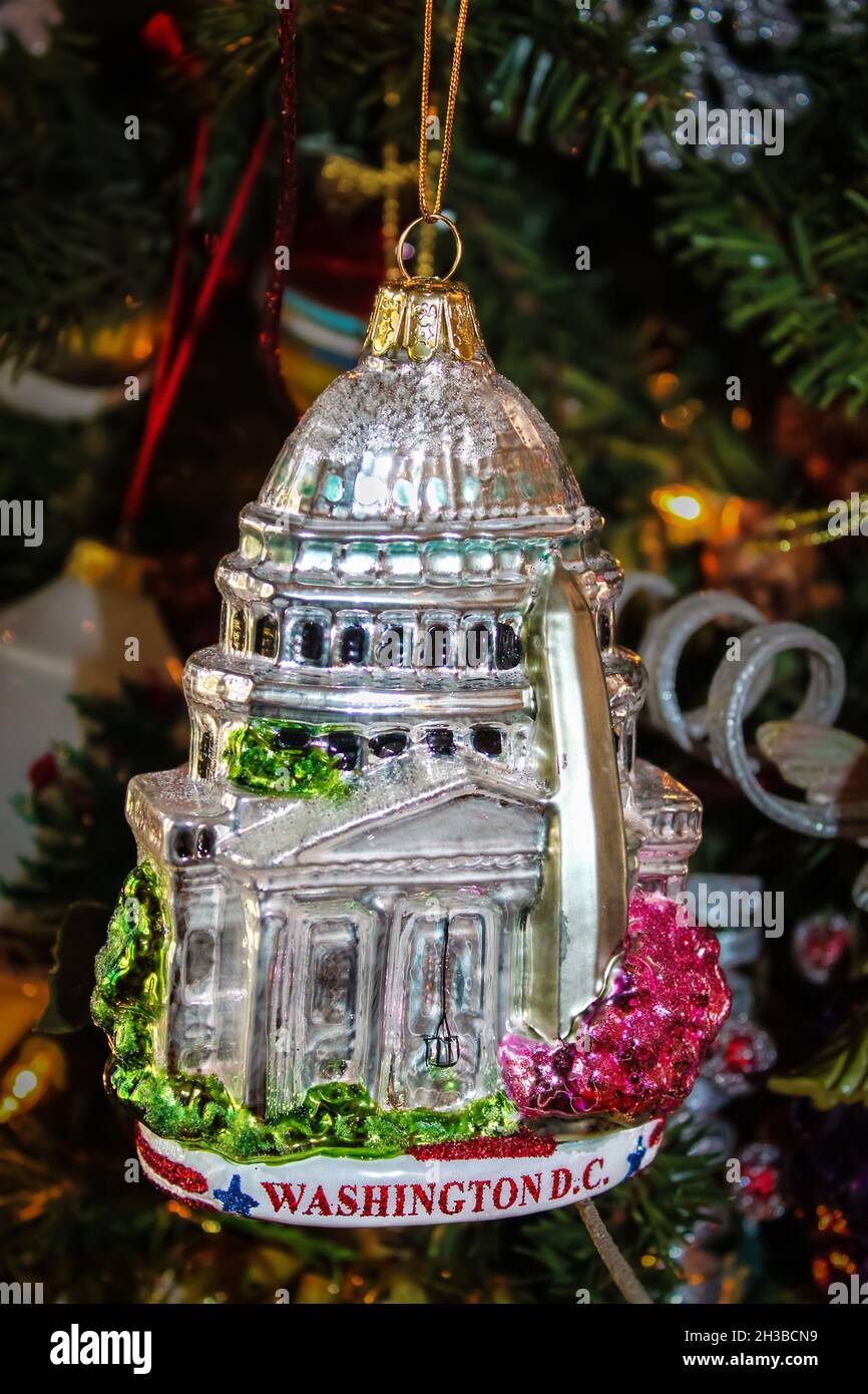 Christmas ornament of Capitol building in Washington DC hanging on old fashioned Christmas tree Stock Photo