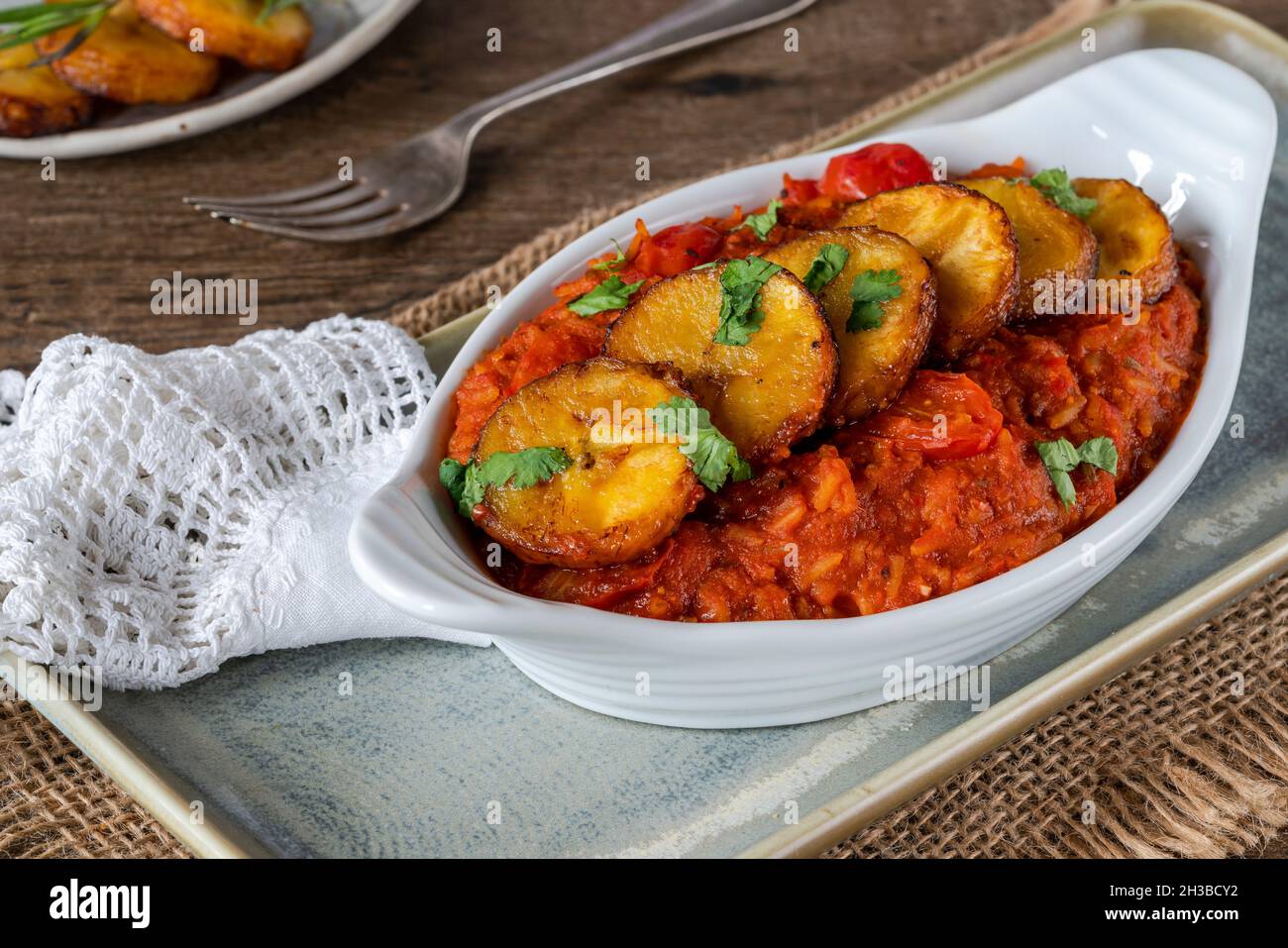 Jollof rice with deep fried plantain spicy vegetarian African rice