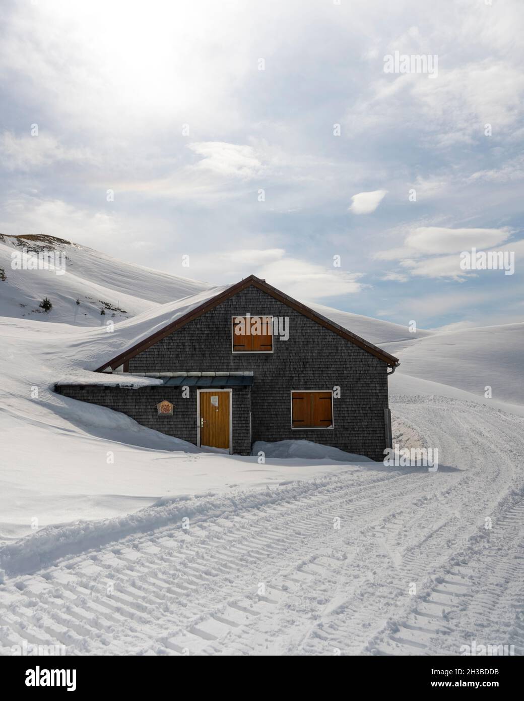 Mountain cabin covered with snow Stock Photo