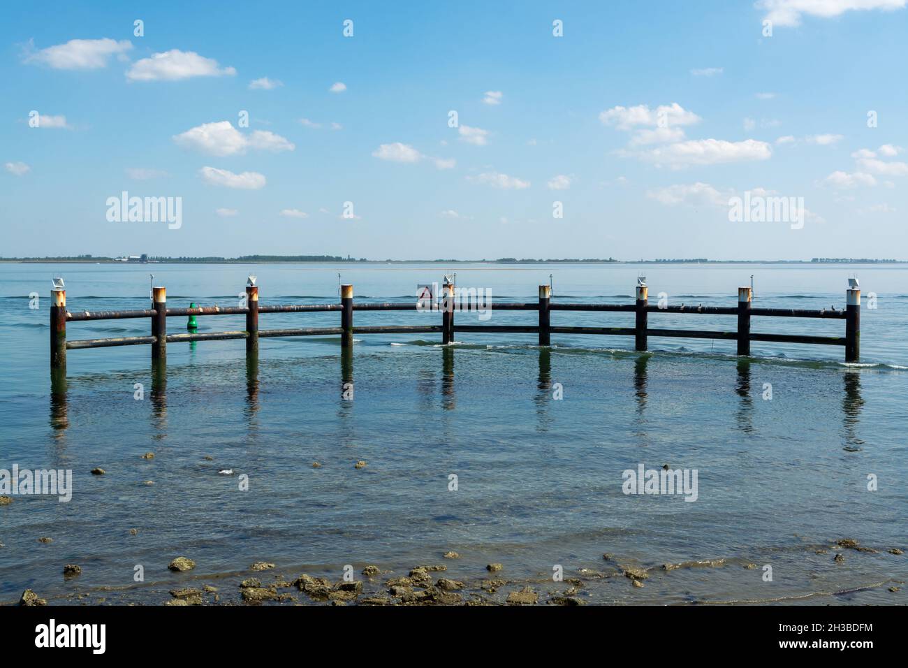 Walking along shoreline and beaches of Oesterschelde near Yerseke at low tide, Zeeland, Netherlands Stock Photo