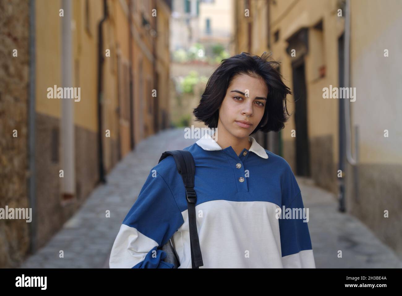 Teenage girl posing in the street of the Italian old town Stock Photo