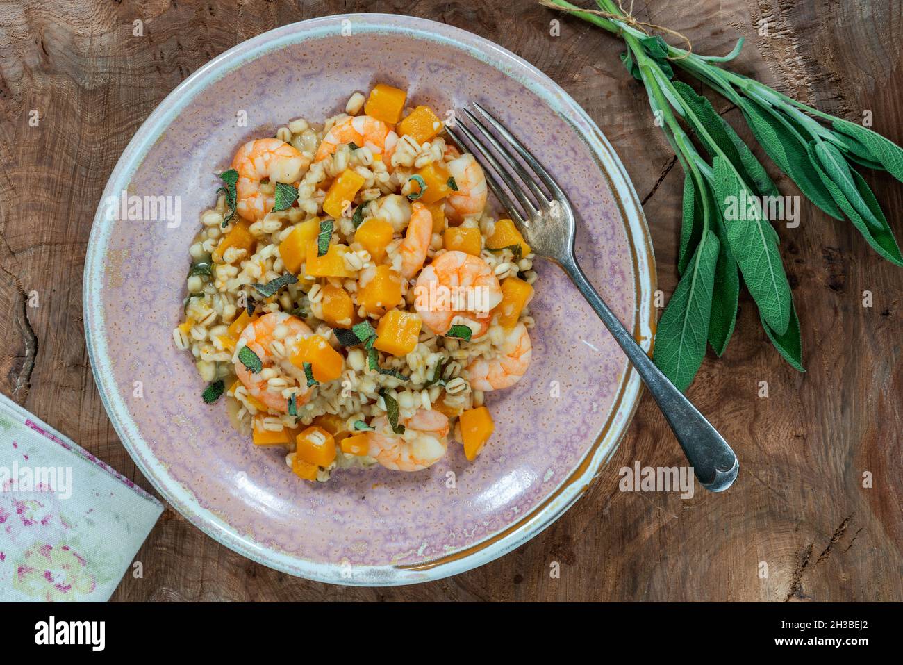 Pearl barley risotto with king prawns, butternut squash and sage overhead view Stock Photo Alamy