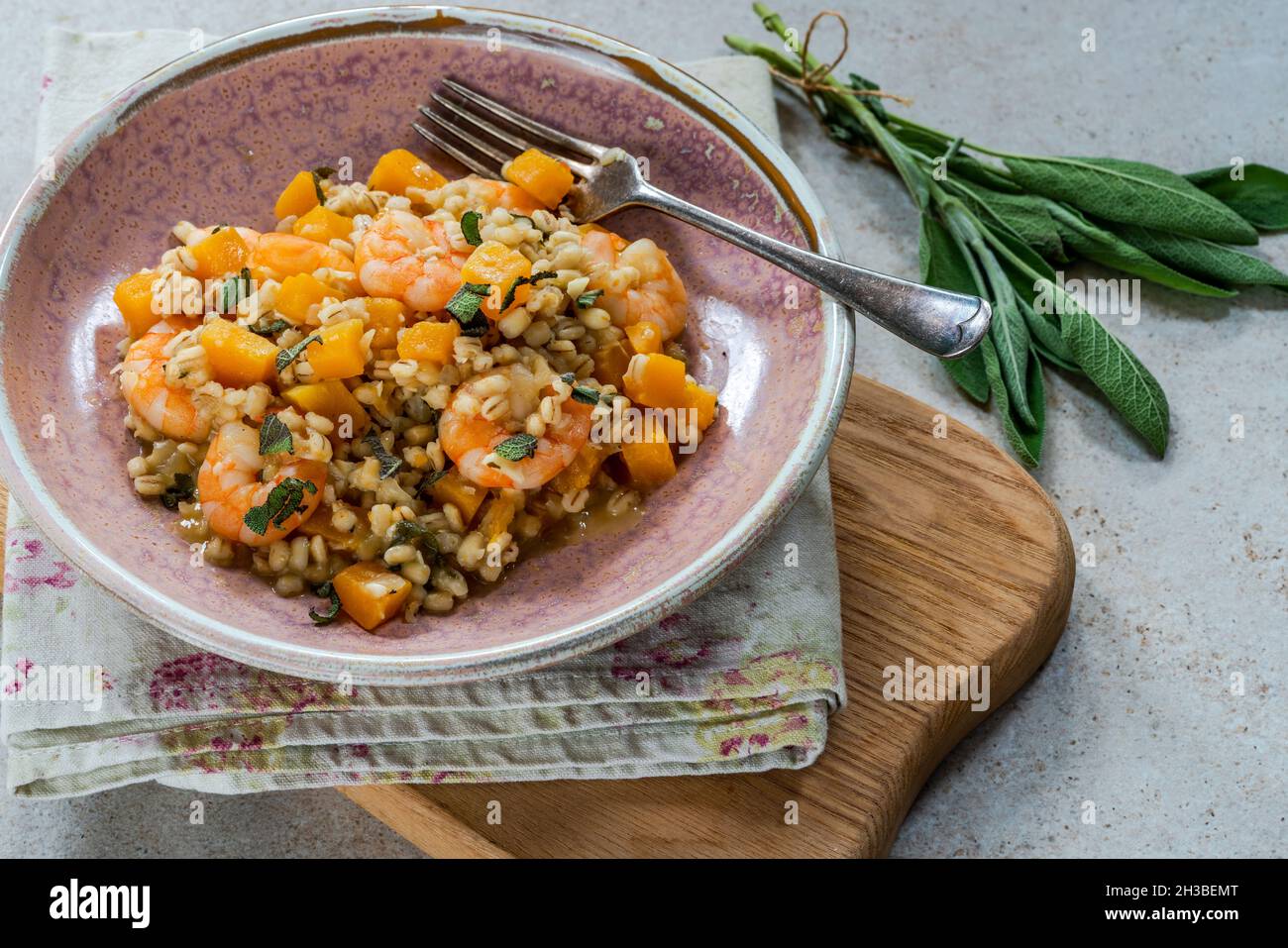 Pearl barley risotto with king prawns, butternut squash and sage Stock Photo Alamy