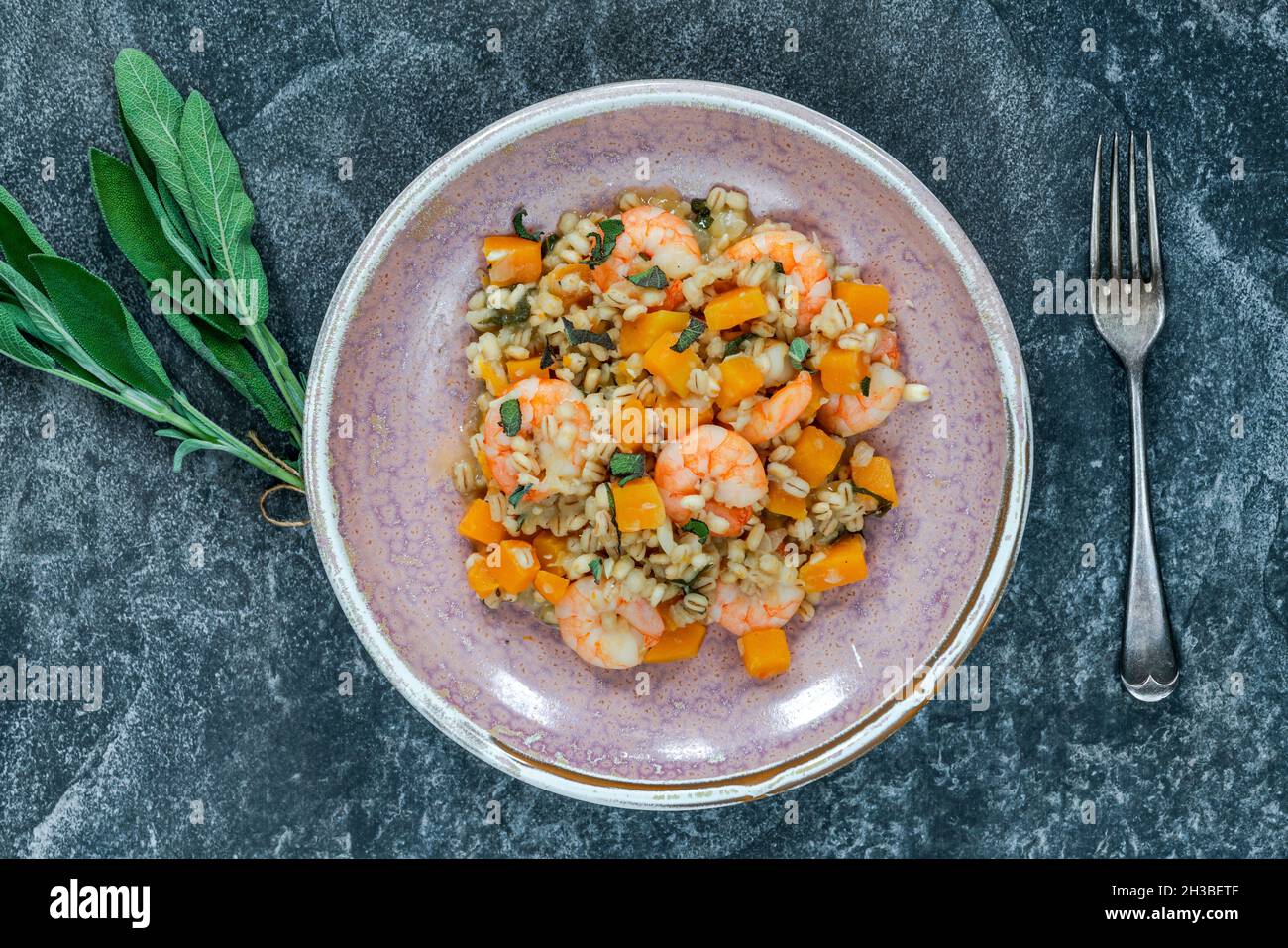 Pearl barley risotto with king prawns, butternut squash and sage overhead view Stock Photo Alamy