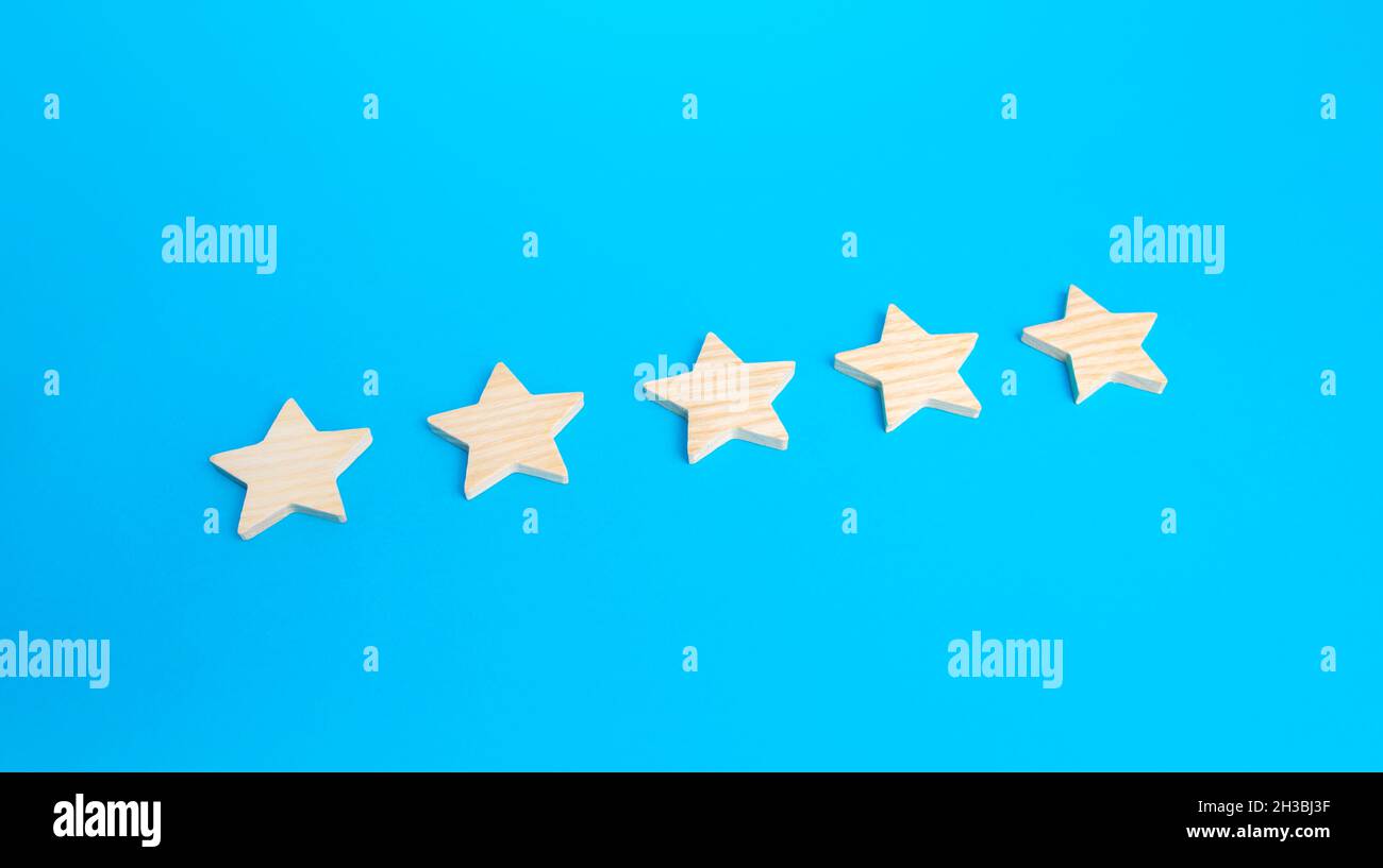 Five rating stars. Rating evaluation concept. High satisfaction. Popularity of restaurants, hotels or mobile applications. Highest score. Service qual Stock Photo
