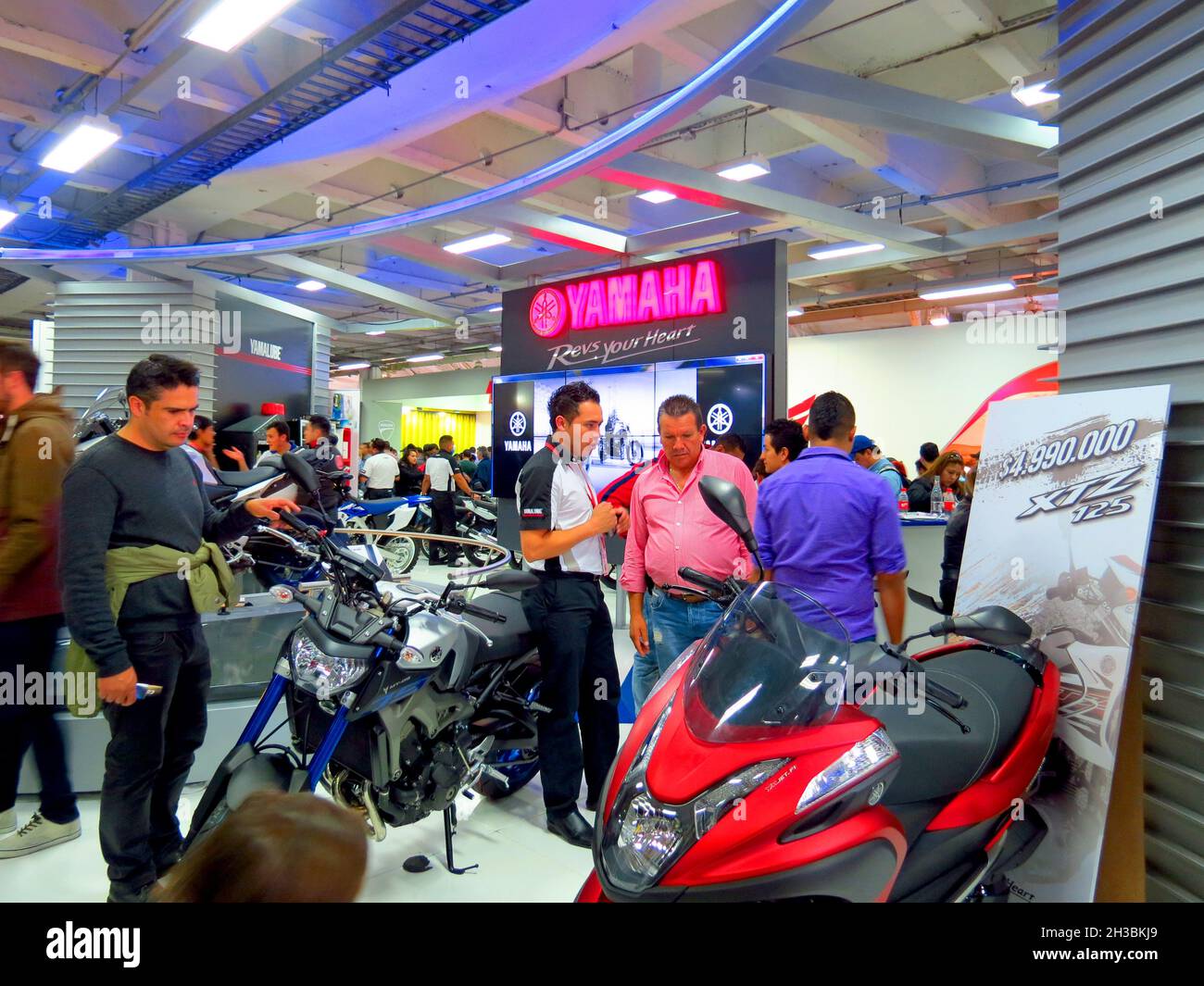 BOGOTA, COLOMBIA - May 31, 2018: A group of people at a car and motorcycle exhibition in Bogota, Colombia Stock Photo
