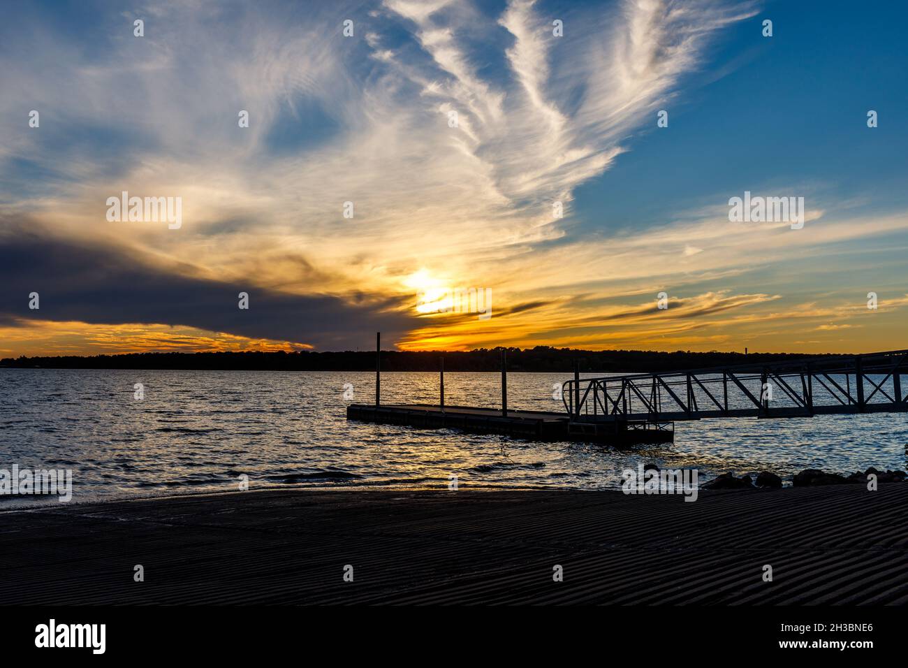 Beautiful cloudy sunset at Thunderbird lake. Stock Photo