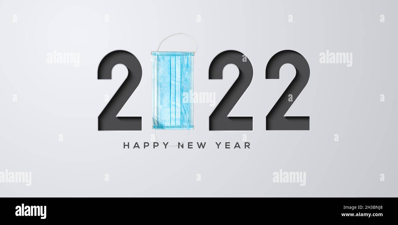 happy new year 2022- Covid 19 - Concept card with syringe and mask Stock Photo