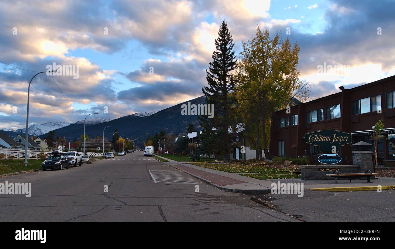 Cityscape of small town Jasper in the Rocky Mountains with Geikie St and tourist accommodation Chateau Jasper with beautiful evening sky in autumn. Stock Photo