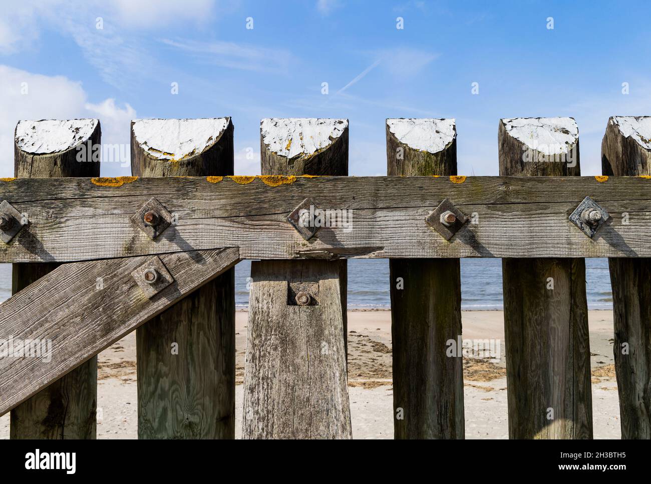 The photo shows a massive wooden fence on the island of Baltrum Stock Photo
