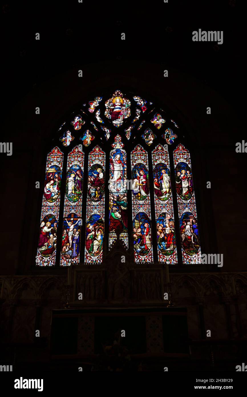 Stained glass window in Britains second smallest cathedral.  St Asaphs cathedral, St Asaph. Denbighshire, Wales. Stock Photo