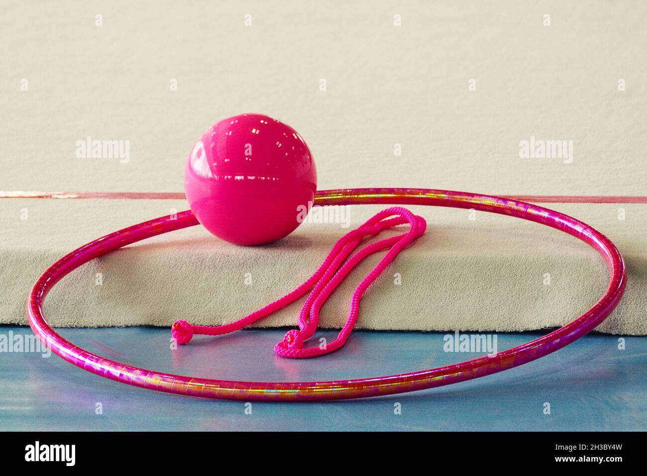 set of apparatus for rhythmic gymnastics in pink color ball, hoop, jump  rope Stock Photo - Alamy