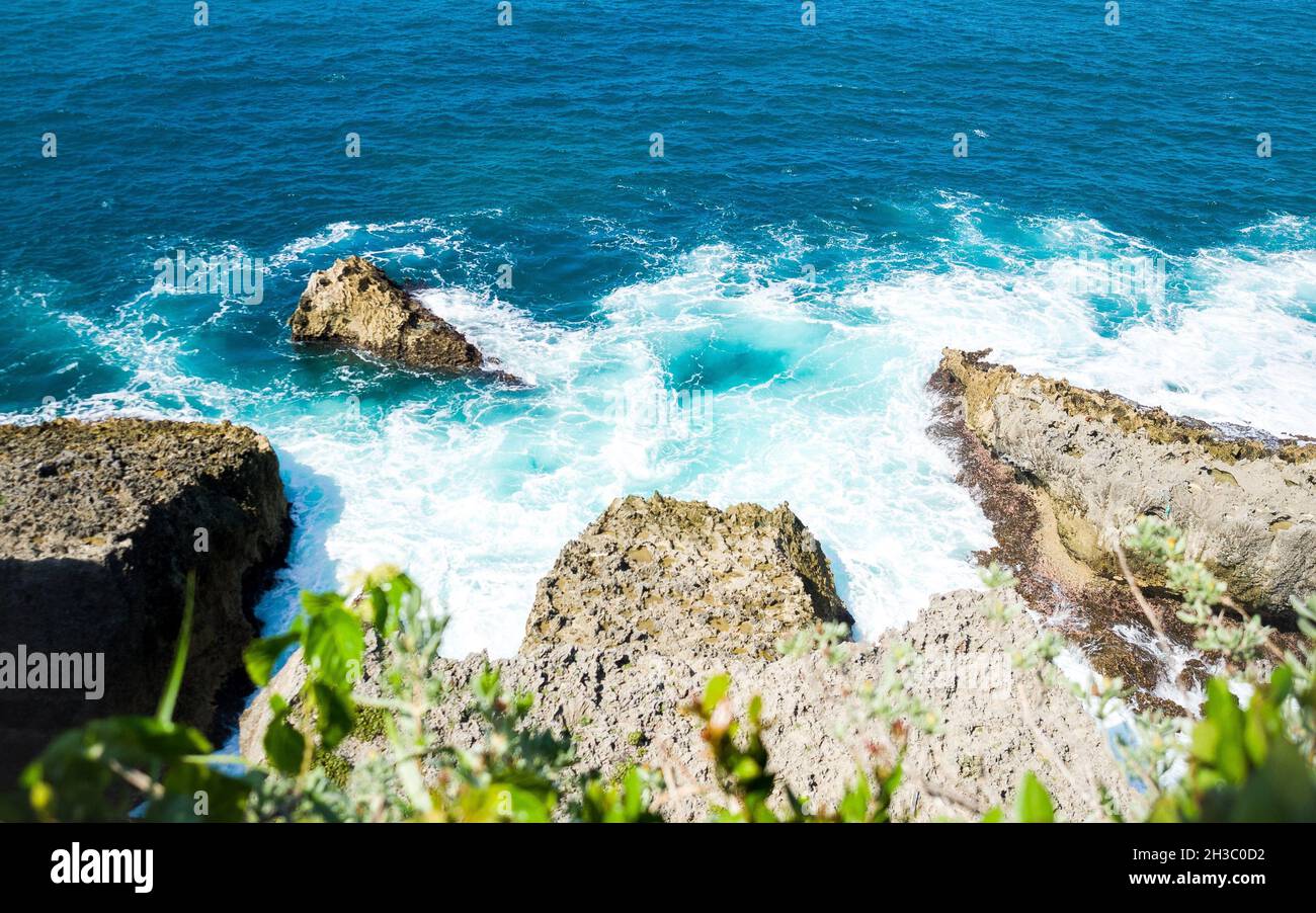 Beautiful scene of foamy sea waves and rocky shoreline Stock Photo - Alamy