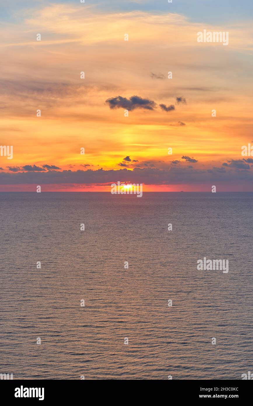 Sunrise at sea with clouds in the sky and blue and orange colors Stock ...