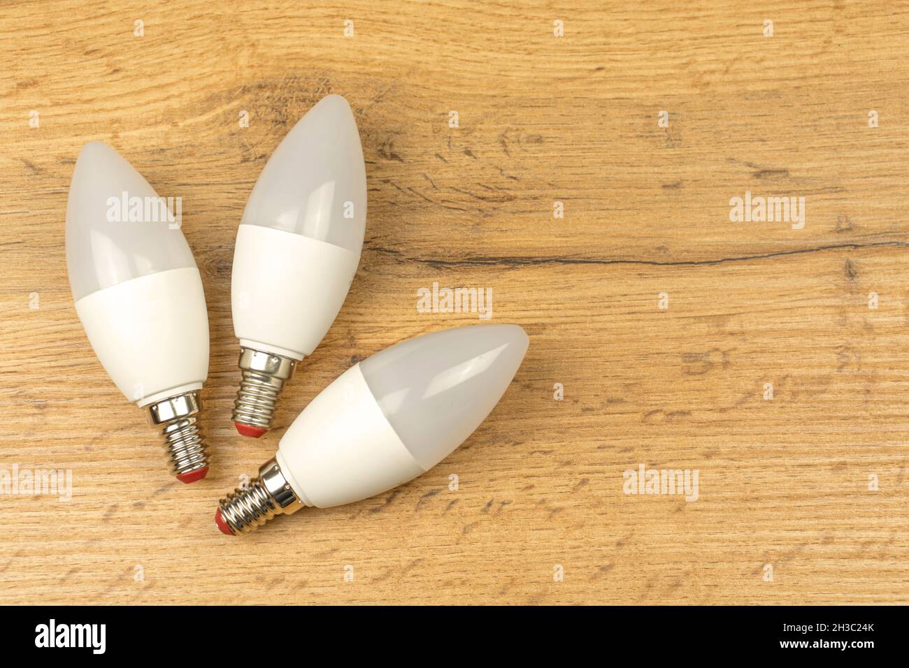 Energy saving, eco friendly LED light bulbs, wooden table background Stock Photo