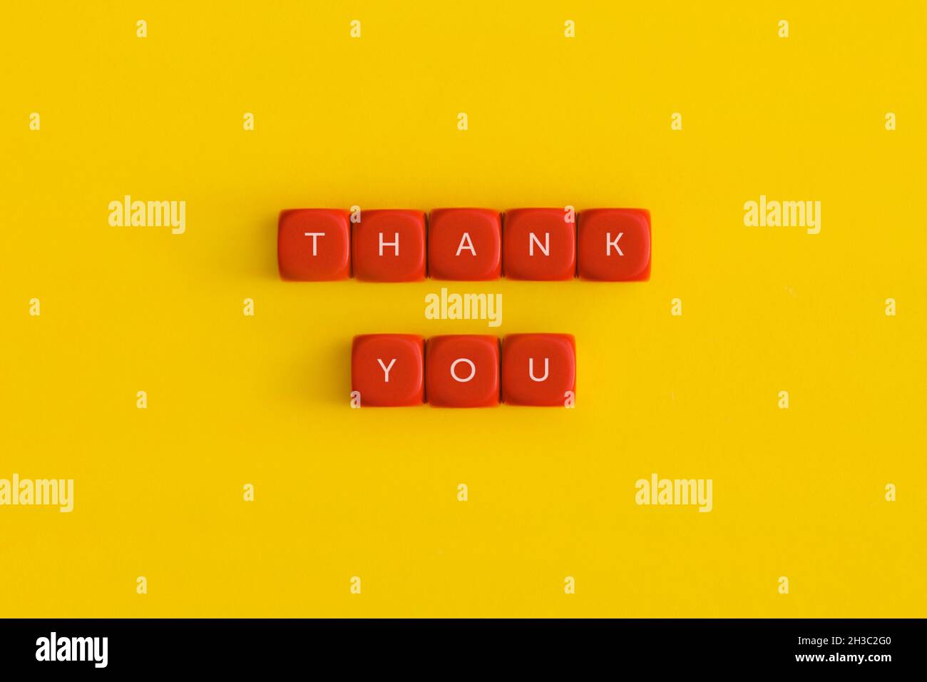 The words 'Thank you' on a red cubes Stock Photo