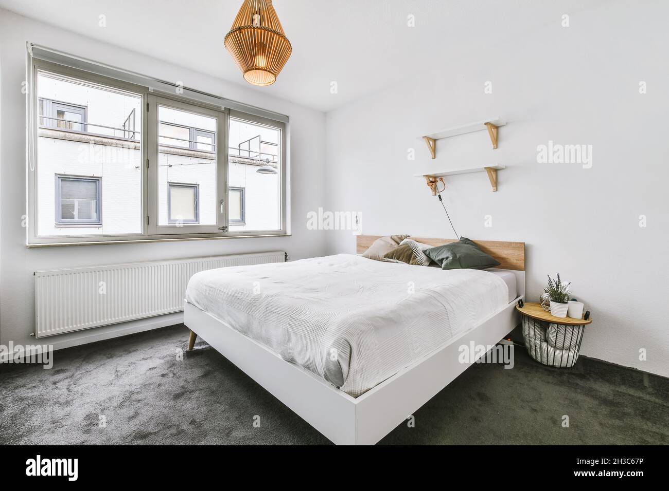 Beautiful interior design of modern and cozy bedroom Stock Photo - Alamy