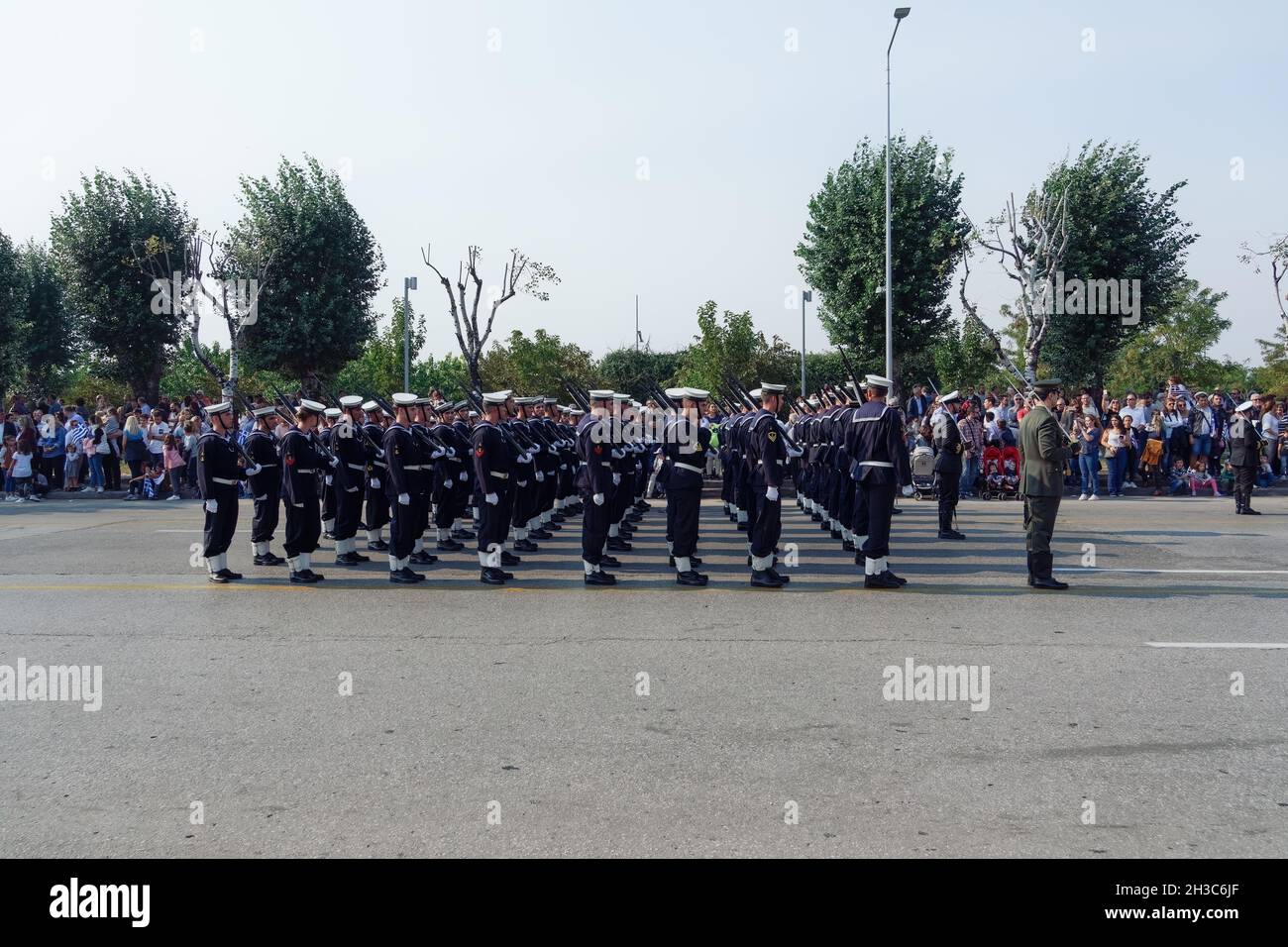 Thessaloniki, Greece - October 28 2019: Oxi Day Greek Navy personnel parade. Hellenic military march during national day celebration, with attending crowd. Stock Photo