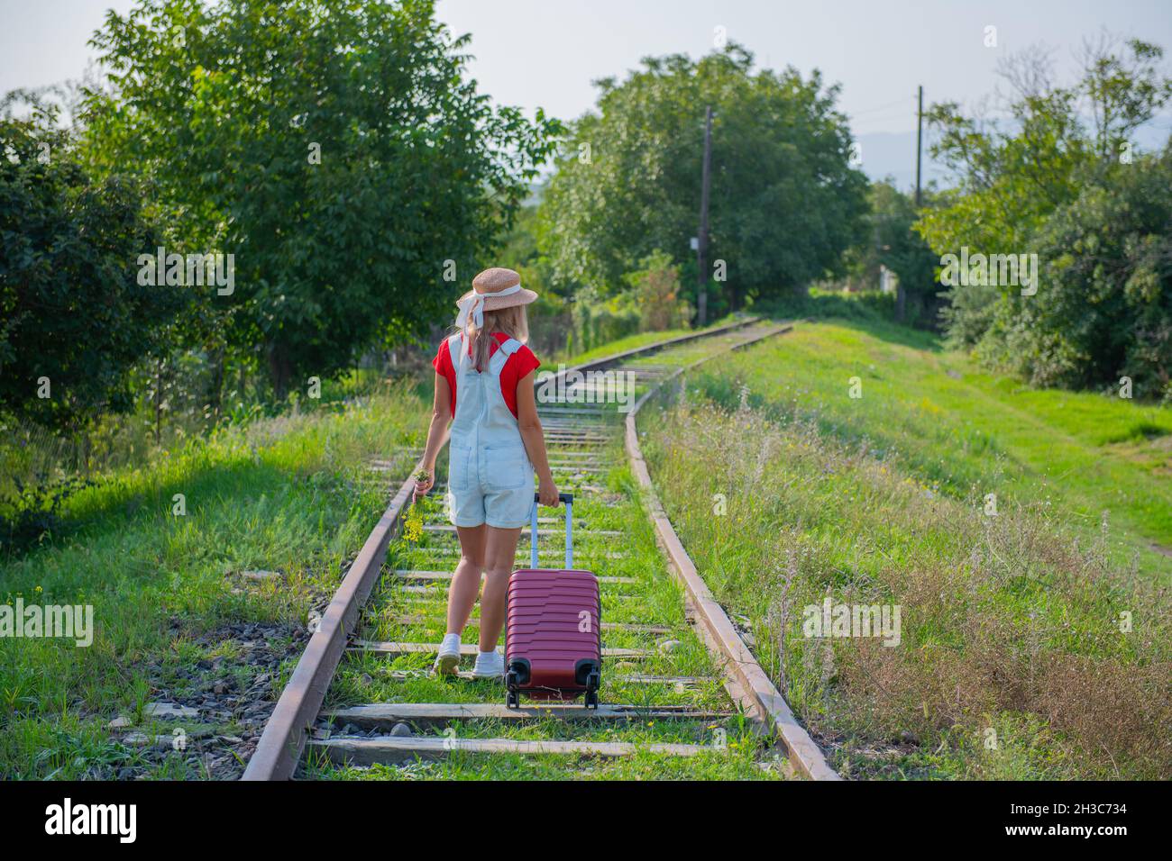 Woman walks along railway hi-res stock photography and images - Alamy