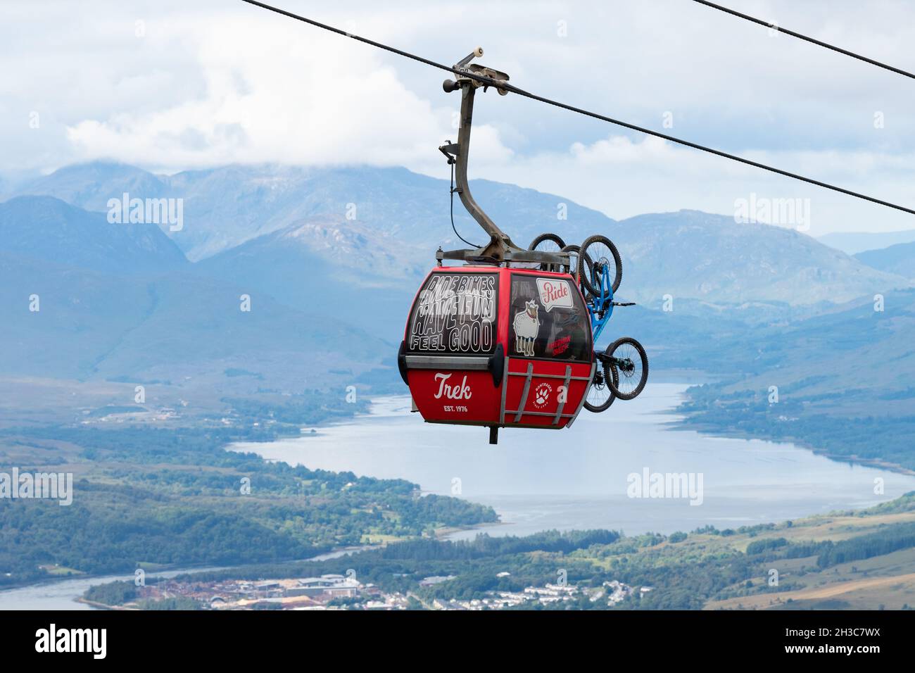 Trek branded cable car carrying people riders and mountain bikes -  Nevis Range Mountain Gondola, Fort William, Scotland, UK Stock Photo