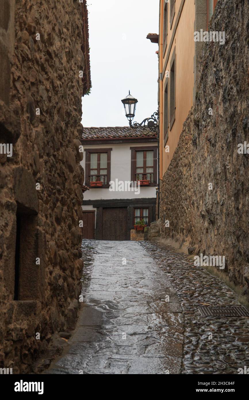 Vertical shot of an old street with old brick houses Stock Photo - Alamy
