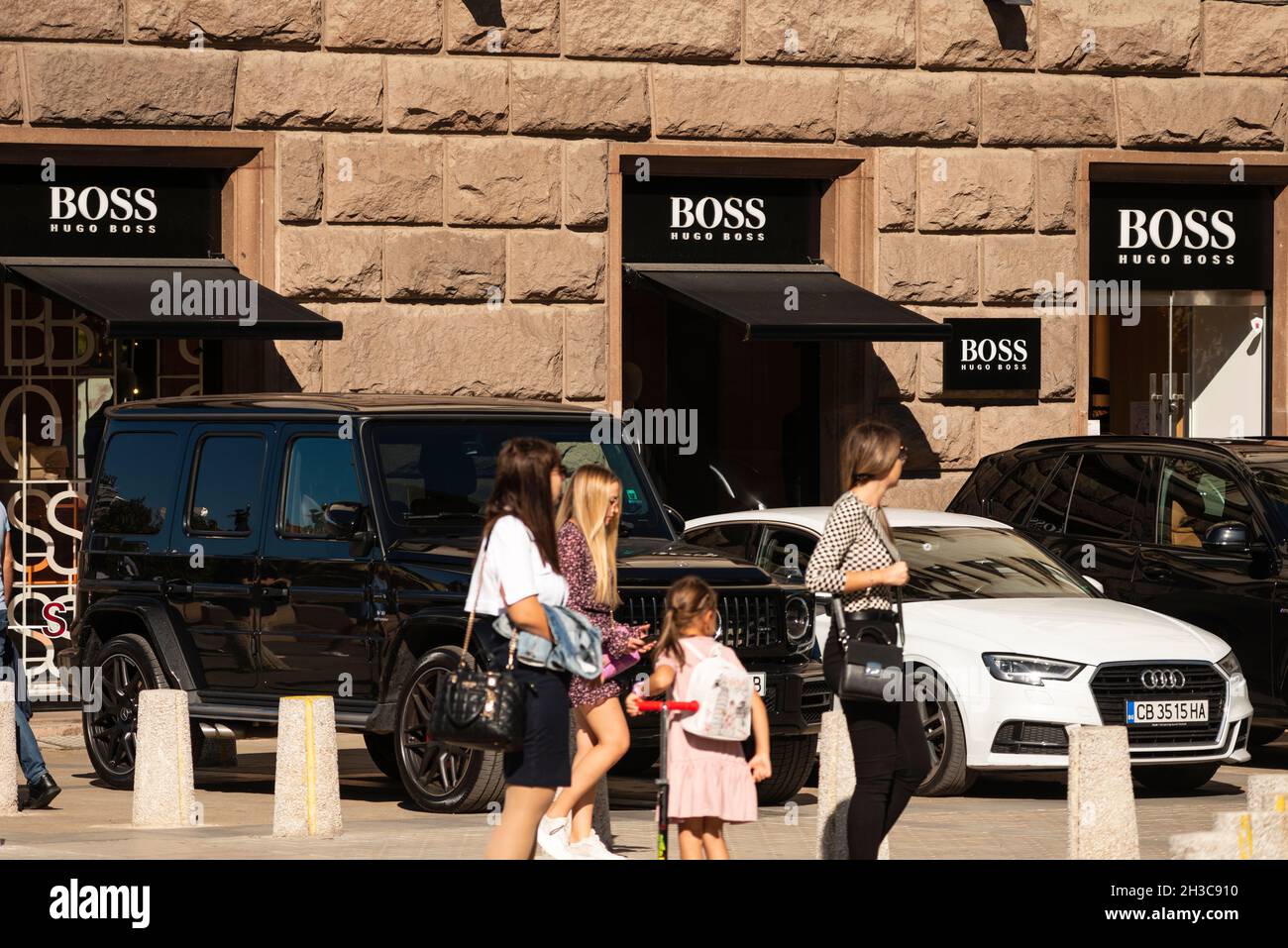 People walking past the Hugo Boss official store in Saborna Street