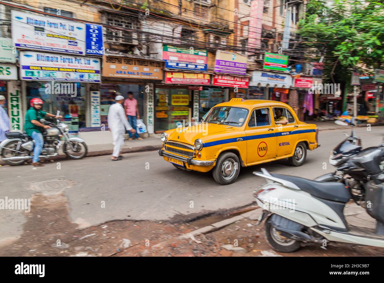 KOLKATA, INDIA - OCTOBER 27, 2016: View of yellow Hindustan Ambassador taxi in the center of Kolkata, India Stock Photo