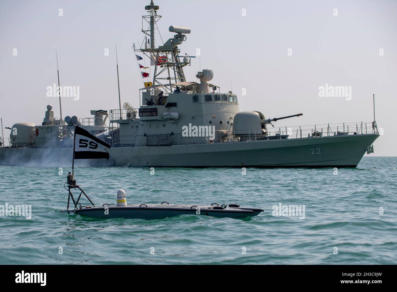Arabian Sea, Baharain. 26th Oct, 2021. Arabian Sea, Baharain. 26 October, 2021. A U.S. Navy Mantas T-12 unmanned surface vessel operates alongside the Royal Bahrain Naval Force fast-attack craft RBNS Abdul Rahman Al-fadel during exercise New Horizon October 26, 2021 in the Arabian Gulf. The Mantas is a next-generation multi-role unmanned surface vessels for intelligence, surveillance and reconnaissance operations. Credit: MC2 Dawson Roth/US Navy/Alamy Live News Stock Photo