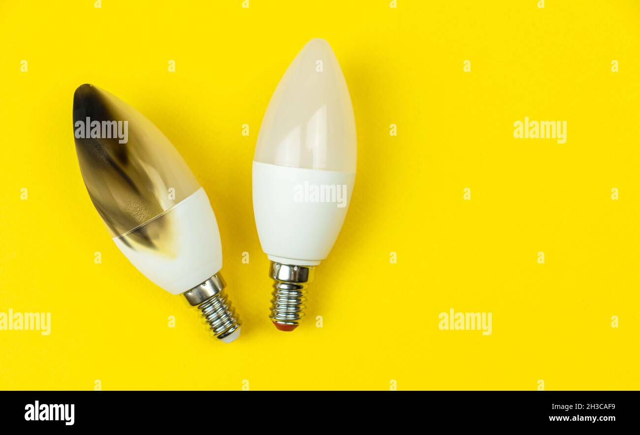 LED light bulb after fire. Concept of electrical short circuit. Burning  wire in house, dangerous, failure. Home safety. Top view, yellow background  Stock Photo - Alamy