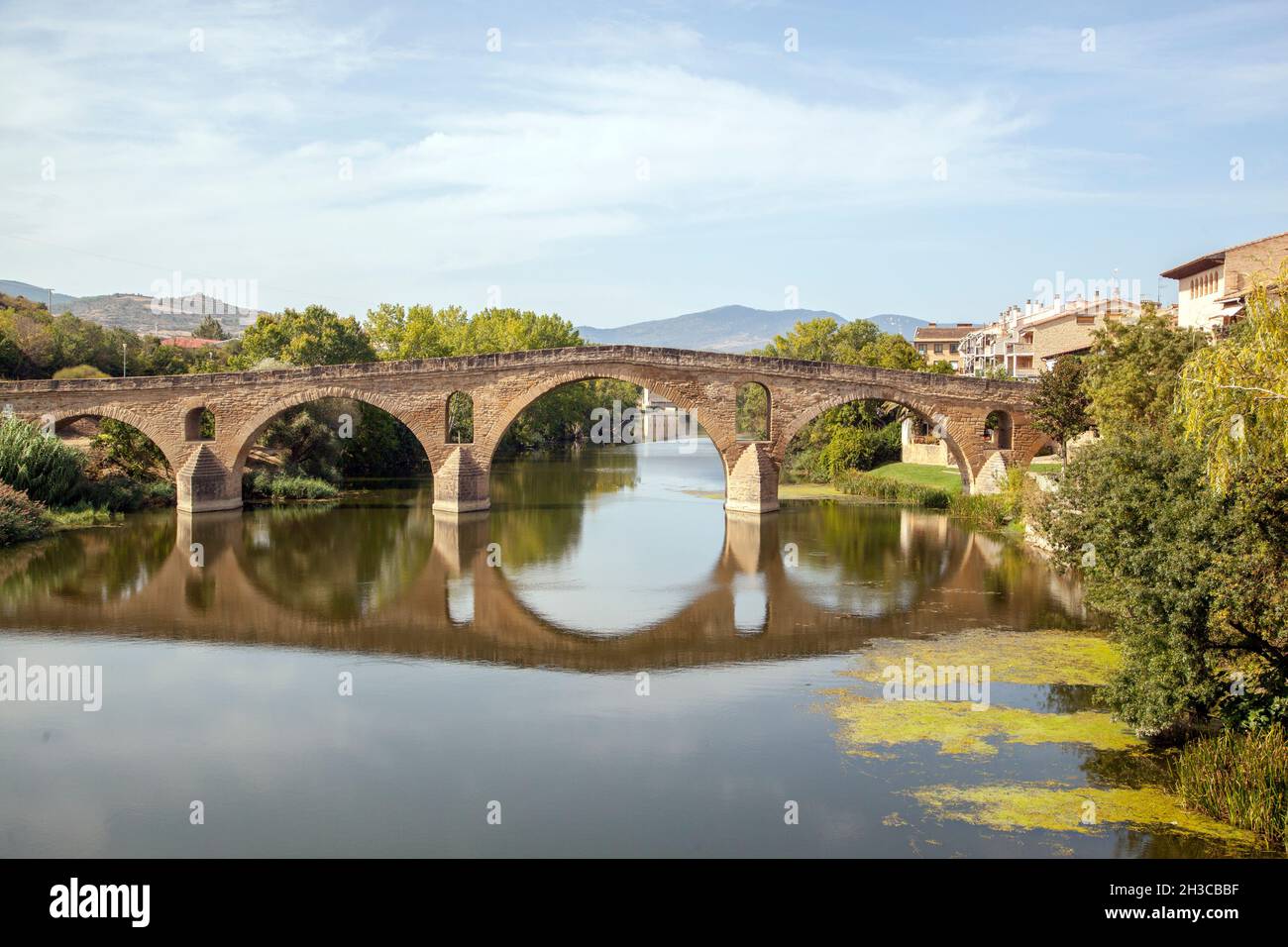 Romanesque Bridge The Puente Romanico medieval bridge over the river Arga in the Spanish ...