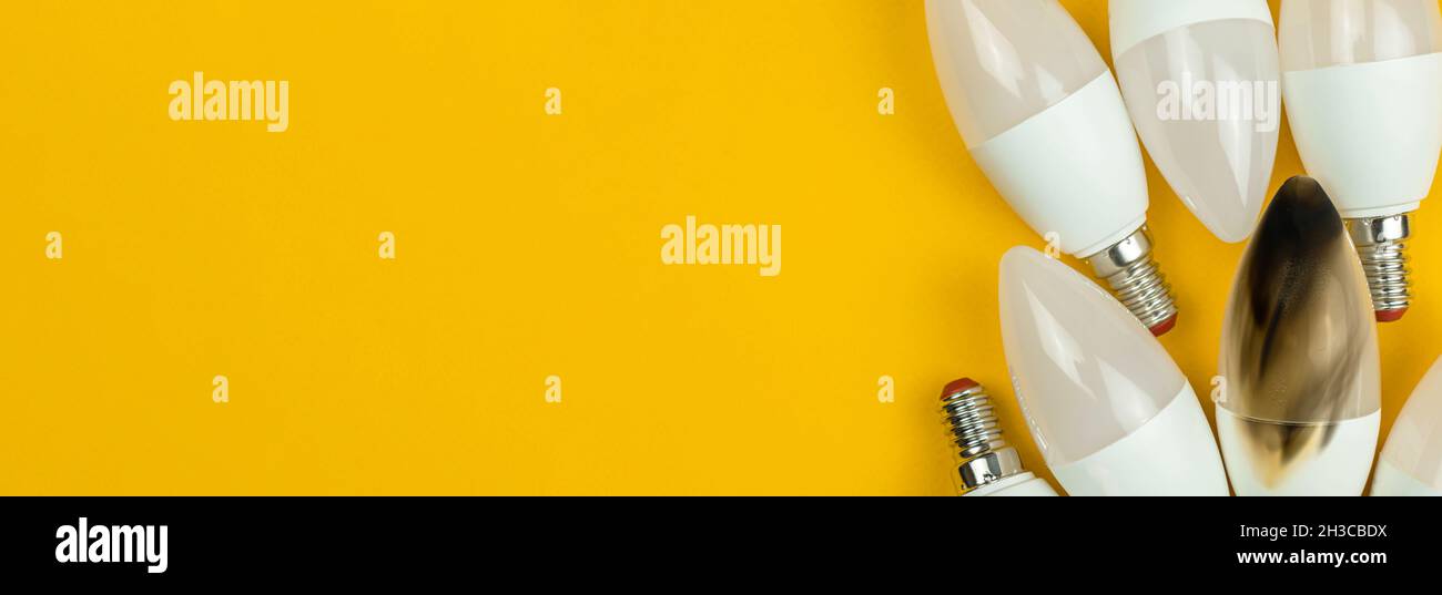 Broken LED light bulb after fire, home safety concept, electrical short