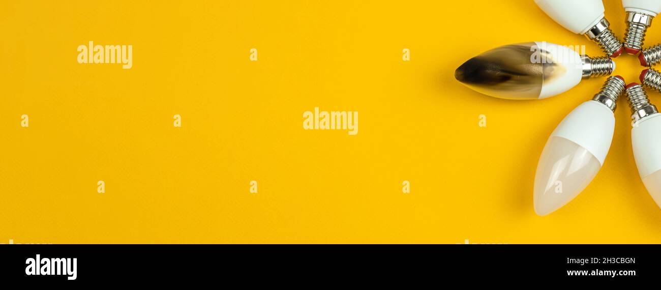 Home safety concept. Broken and burn out LED light bulb after fire. Top