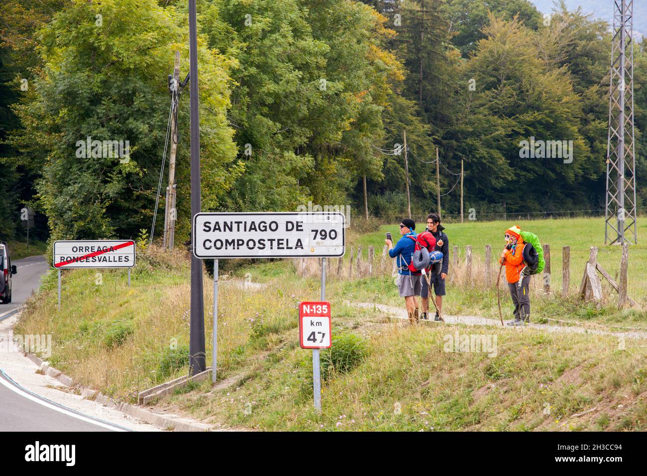 Pilgrims in Roncesvalles at the start of the Camino de Santiago the way of St James walking to Santiago de Compostela the Spanish pilgrimage route Stock Photo
