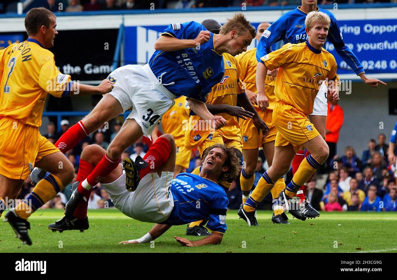 Pompey scorer Neil Barrett lunges in on the Gillingham goal. Pic MIKE