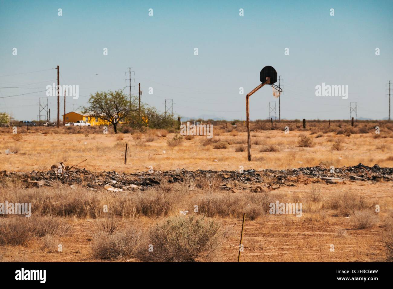 a broken basketball hoop in a field in rural Arizona, United States Stock Photo